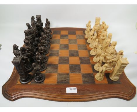 Lovely Two Colour Wooden Chess board which measures approx 19 x 19 inches.  The Black Army is cast from plaster and has some 
