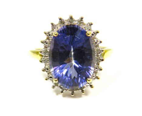 9ct Yellow Gold Ring set with a Large Central Tanzanite (14 x 9mm) with Diamond Surround.  Finger size 'S'   4.5g