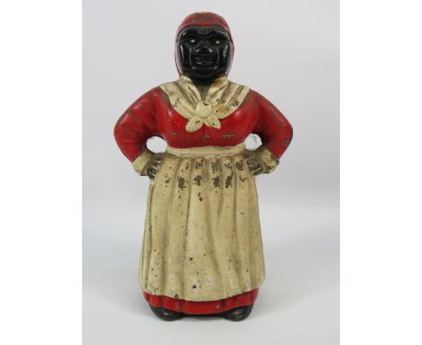 Vintage cast iron black Americana Aunt Jemima money box, 10.5" tall. Notice from the the-saleroom.com: These items are listed
