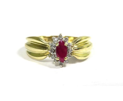9ct Yellow Gold Ring set with a Central Oval Ruby (6 x 3mm) with Diamond Surround.  Finger size 'M'    2.3g