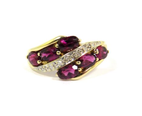 9ct Yellow Gold Ring set with six Rhodalites with a band of Diamond Chips. Finger size 'Q'  2.4g