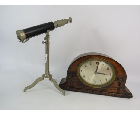 Art deco wooden mantle clock in working order plus a small french table top telescope.