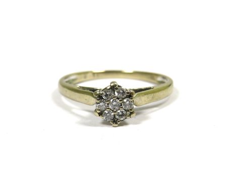 18ct White Gold Ring set with 7 Diamonds of 0.15pts.  Fingers size N   2.3g