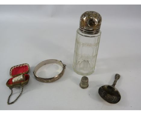 Mixed sterling silver including Two Thimbles, bangle, sugar sifter etc, silver weight 44 grams.