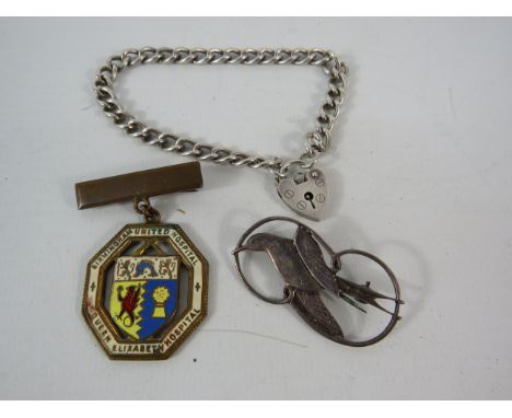 Sterling silver brooch and bracelet with padlock plus a Queen Elizabeth Hospital enamel badge.