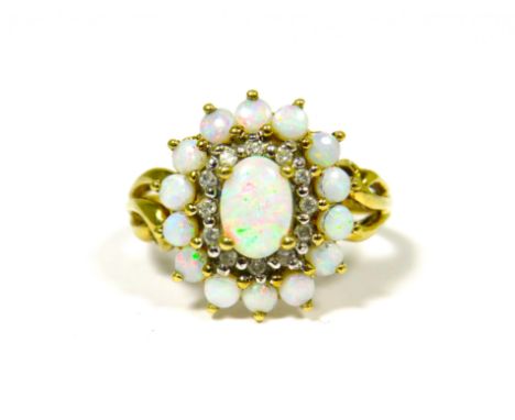 9ct Yellow Gold Ring Set with a Central Opal with Diamond and Opal Surround.  Fingers size 'O-5'   3.0g