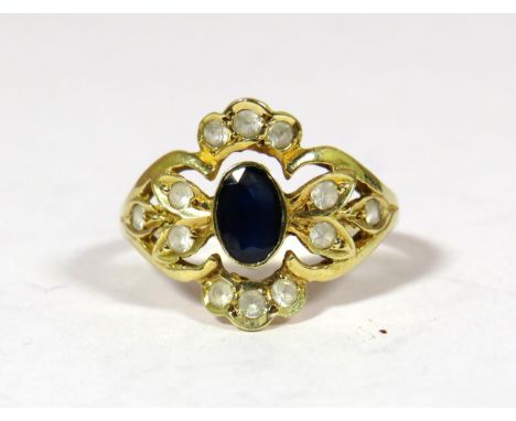 14ct yellow Gold Ring set with a Central Sapphire (6 x 4 mm) surrounded by 12 Small White Sapphires. Finger size 'N'  2.7g 