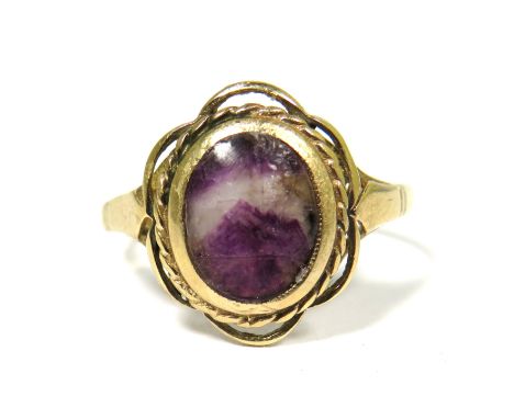 9ct Yellow Gold Ring set with a central Oval Blue John Stone (10 x 8mm).  Finger size 'Q'  2.8g.   Hallmarked for Birmingham 