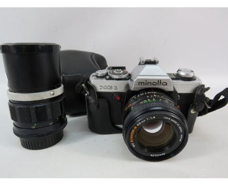 Minolta XG1 camera plus a 135mm lense.