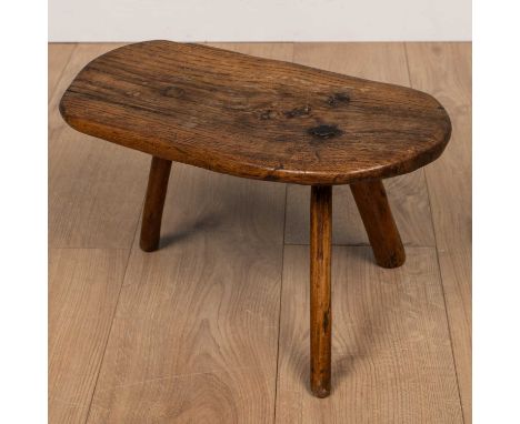 A 19th century elm rustic low stool, the shaped and rounded top on three stick supports43.5cm wideQty: 1Good condition overal