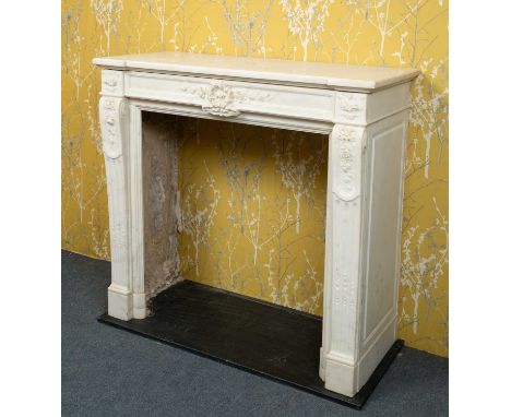 A contemporary white marble chimney piece in the French style, with scroll topped fluted pilasters to either side, with plain