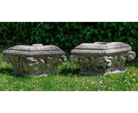 A pair of Victorian carved limestone architectural elements of canted form decorated with acanthus leaf scrolls and flowerhea