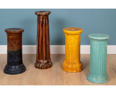 A group of four Burmantofts glazed pottery plinths of differing colours.the largest 89cm highQty: 4Minor marks overall. Some 
