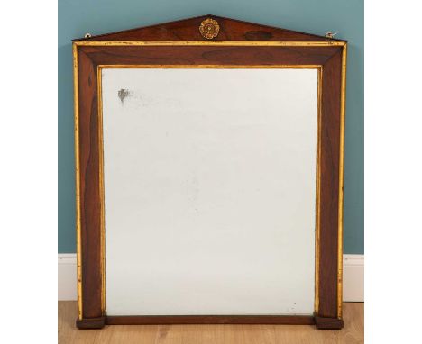 A William IV rosewood wall mirror, with gilt mouldings and central stylised flower head decoration to the architectural crest