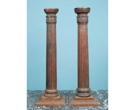 A pair of oak table lamp bases with carved ornament and fluted columnseach 18cm wide x 57cm highQty: 2The top of one column i
