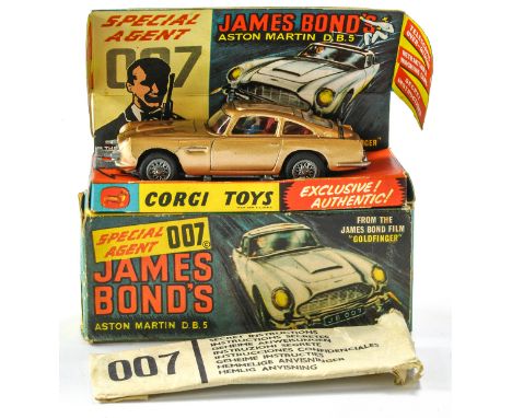 Corgi No. 261 James Bond 007 Aston Martin DB5. With (opened) secret instructions and spare bandit figure. Generally excellent