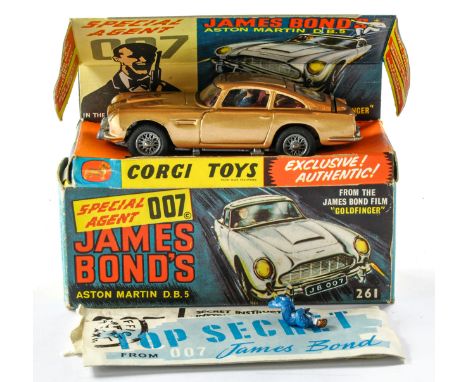 Corgi No. 261 James Bond 007 Aston Martin DB5. With (opened) secret instructions and spare bandit figure. Generally excellent