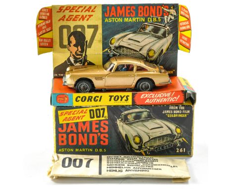 Corgi No. 261 James Bond 007 Aston Martin DB5. With (opened) secret instructions and spare bandit figure. Generally very good