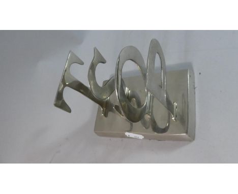 A Silver Plated Letter Rack Formed Form the Letters POST, 14cm Long 