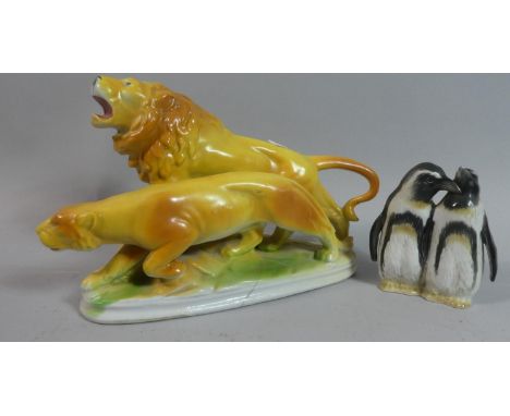 A Continental Ceramic Lion Ornament (AF) Together with a Penguin Ornament 
