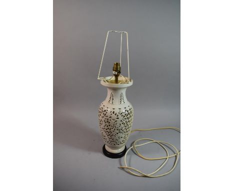 An Oriental Reticulated Ceramic Table Lamp with Bamboo Decoration, 40cm high 