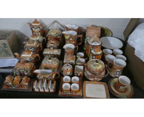 A Large Collection of Cottagewares to Include Teapot, Coffee Pots, Lidded Storage Jars, Butter Dish, Toast Racks, Egg Cups, B