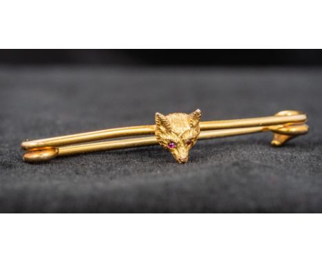 A 9 ct gold ruby set fox mask brooch4.5 cm long overall.  CONDITION REPORTS: Generally good condition, expected wear. Approxi
