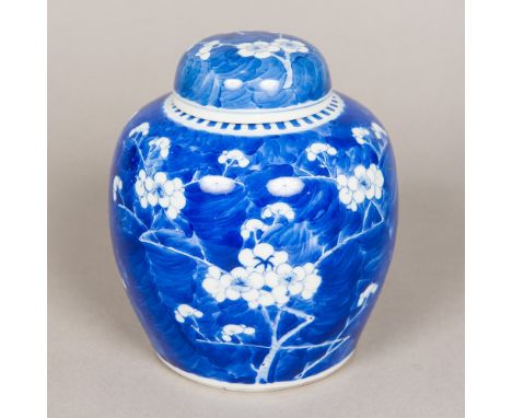 A 19th century Chinese blue and white ginger jar and coverDecorated in the round with prunus blossom, the underside with blue