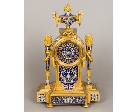 A 19th century French cloisonne decorated ormolu mantel clockThe fruiting twin handled urn above a bow tied swag and the enam