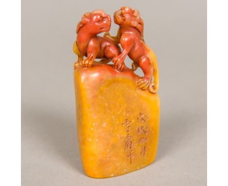 A Chinese carved Shoushan stone sealSurmounted with a pair of temple lions and worked with calligraphic text.  8.5 cm high. P
