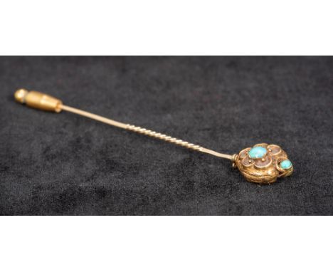 A yellow metal turquoise set memorial stick pinThe hinged heart shaped finial enclosing a hair work panel.  8.5 cm long.  CON