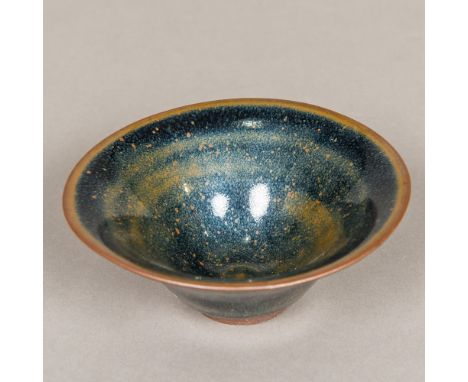 A Chinese Song porcelain oil splash tea bowlOf flared form, with Jian ware glaze, incised four character "archaic" mark to ba