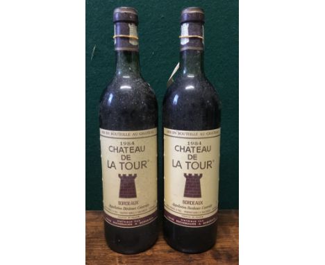 Chateau de la Tour Bordeaux 1984Two bottles.  (2) CONDITION REPORTS: Generally good with expected wear, some scuffing/stainin