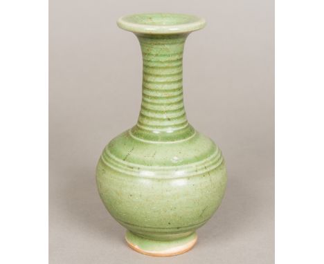 A Chinese porcelain baluster vaseWith allover celadon glaze.  17.5 cm high. Provenance:  From The Late Harry Lakin Collection