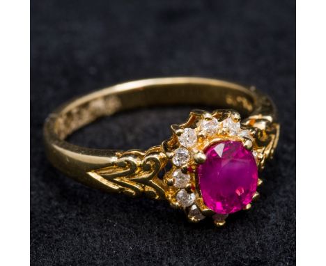 An 18 ct gold diamond and ruby cluster ring9 cm high.  CONDITION REPORTS: Generally in good condition, some general wear.