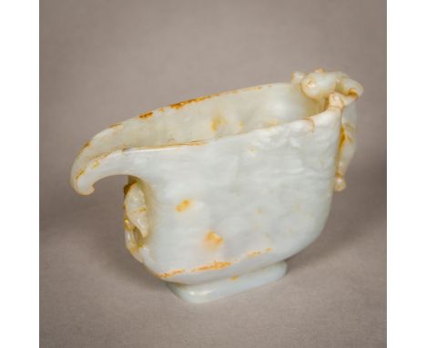 A Chinese carved mutton fat jade ewerOf narrow proportions with mythical beast handle.  7.5 cm high.  CONDITION REPORTS: Gene