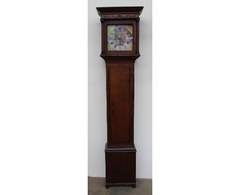 An 18th century and later oak longcase clock, the hood with a moulded cornice, and three quarter columns above a long trunk d