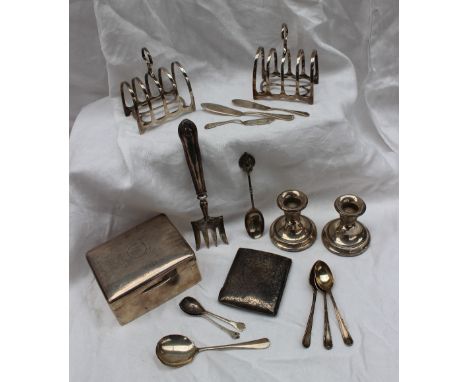A silver cigarette box, 1918, Birmingham, Horace Woodward & Co Ltd together with silver toast racks, silver spoons, silver ci