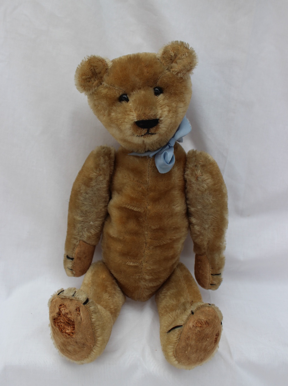 A mohair teddy bear with a movable head, arms and legs, with a hump ...