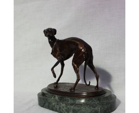 After P J MeneA Whippet playing with a ballMounted on a green veined marble baseBears a signature15cm wide x 18cm high 