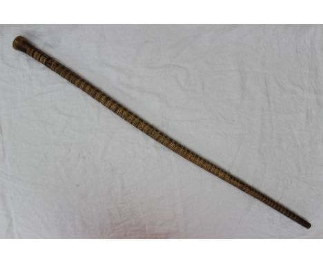 A shark vertebrae walking stick, with a horn knop and base, 87.5cm long