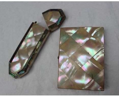 A mother of pearl and white metal inlaid card case, with a compartmented interior together with a mother of pearl and abalone