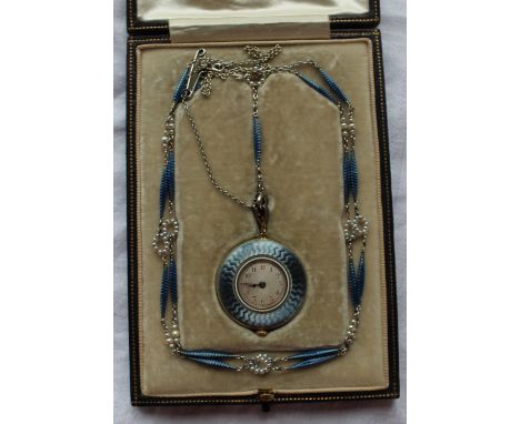 An Edwardian French 18ct gold, blue guilloche enamel and seed pearl fob watch with a silvered dial and Arabic numerals, the c