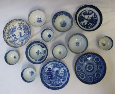 An 18th century English blue and white pearlware tea bowl and saucer depicting "Boy on a buffalo" pattern together with a col