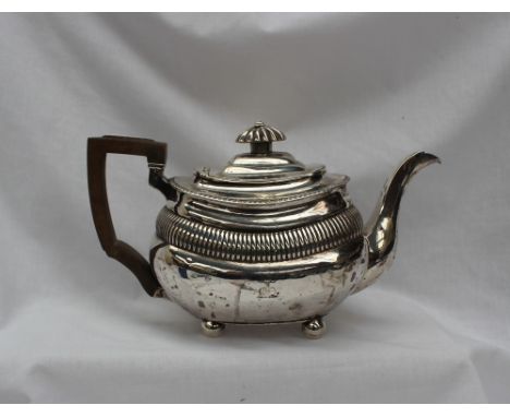 A George III silver teapot, of oval form with partial reeding, London, 1789 or 1809, makers mark indistinct, approximately 58