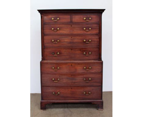 A 19th century mahogany chest on chest, the moulded dentil cornice above two short and three long drawers enclosed between ca