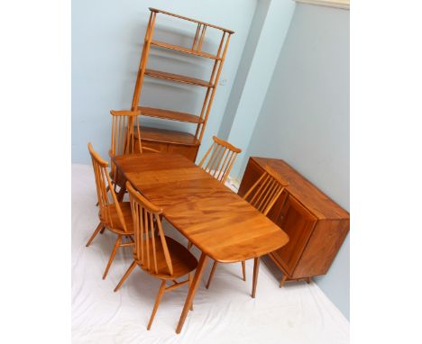 An Ercol dining room suite, comprising an extending dining table with hinged leaf, four chairs and a carver, with a room divi