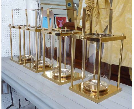 STORM LANTERNS, a set of four, vintage inspired gilt finish, 43cm H. (4)