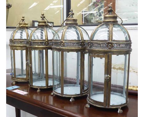 STORM LANTERNS, a set of four, vintage gilt finish, 51cm H. (4)