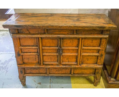 CHINESE SIDE CABINET, early 19th century orange lacquered with two doors on scroll supports, 88cm x 33cm x 68cm H.
